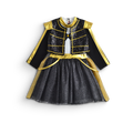 Conjunto infantil con chaqueta negra de lentejuelas y detalles dorados, corpiño blanco y falda negra brillante con ribete dorado.