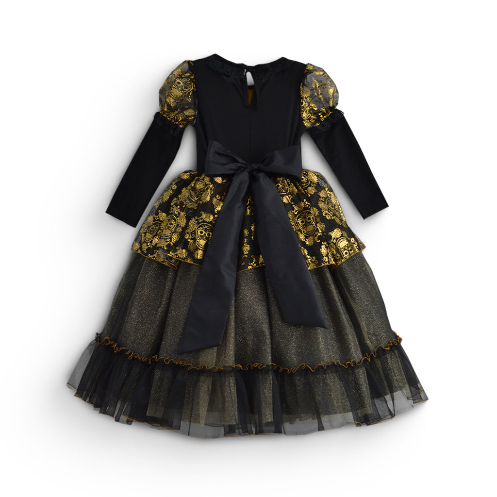 Vestido infantil negro de manga larga con estampado floral dorado en las mangas y la cintura, lazo ancho y falda de tul en capas.